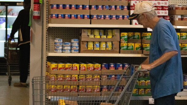 Visitors of God's Food Bank in Guthrie push their carts in the self-serve pantry.