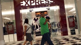Shoppers walk through the Manhattan Mall in New York City.