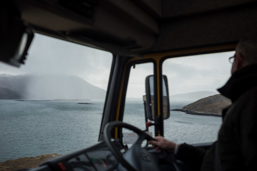 Mobile librarian Steven Bryden watches gusts of rain sweep across west Harris while on the road back from Hushinish. Inclement weather and aging vehicles are the most frequent causes of service disruption.