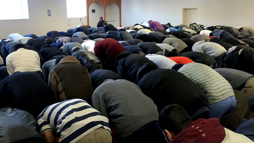 Worshippers bend in prayer at the Islamic Center of Cedar Rapids.