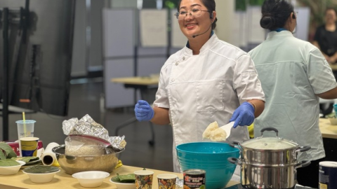 Kristy Xiong leads her students in assembling coconut sticky rice.