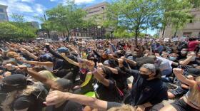 Demonstrators kneel outside of the Hamilton County Courthouse for nine minutes, nearly the same amount of time as the video of George Floyd's death.