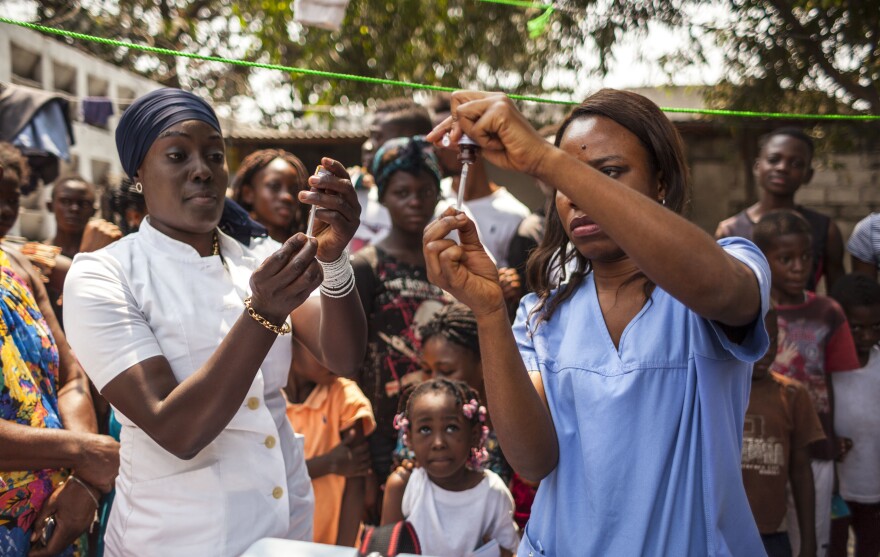 Health workers during the first day of the yellow fever vaccination campaign in Kinshasa, capital of the Democratic Republic of Congo, on August 17.