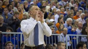 Coach Billy Donovan calls out to plays to his team while pacing the court.