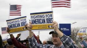 In this file photo Carrier workers and union supporters rally outside the Indianapolis factory Thursday, March 24.