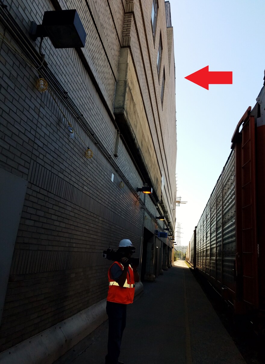 The red arrow in this October 2017 image indicates the back wall of the Omnimax Theater, which had to be replaced. It's about 40 feet tall, 100 feet wide, 20 feet off the ground, and 15 feet away from an active rail line.