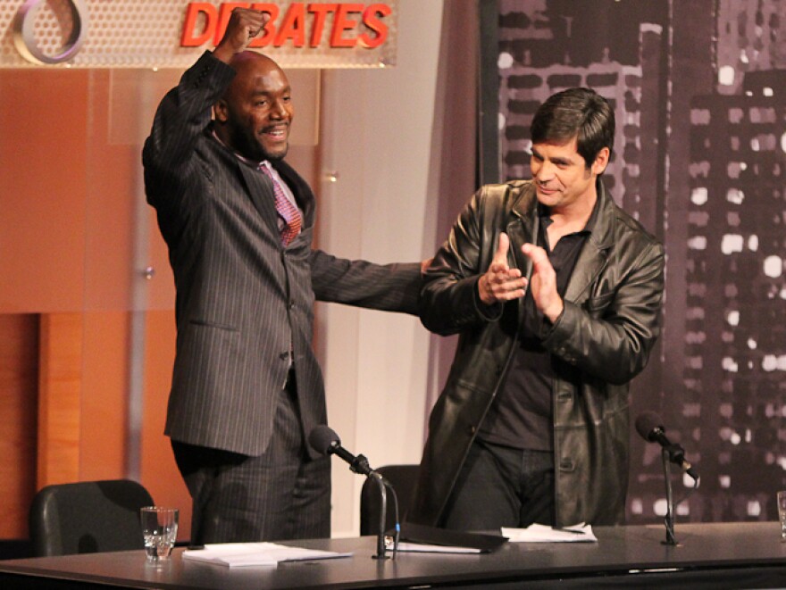 Paul Butler (left) and Nick Gillespie celebrate their victory in an <em>Intelligence Squared U.S.</em> debate. They argued in favor of legalizing drugs.