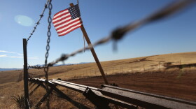 An American flag flies at the U.S.-Mexico border near Sonoita, Ariz. (John Moore/Getty Images)