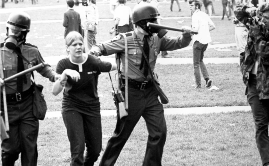 A young woman being detained by Ohio State Troopers during a Vietnam War protest at Ohio State University in April 1970.