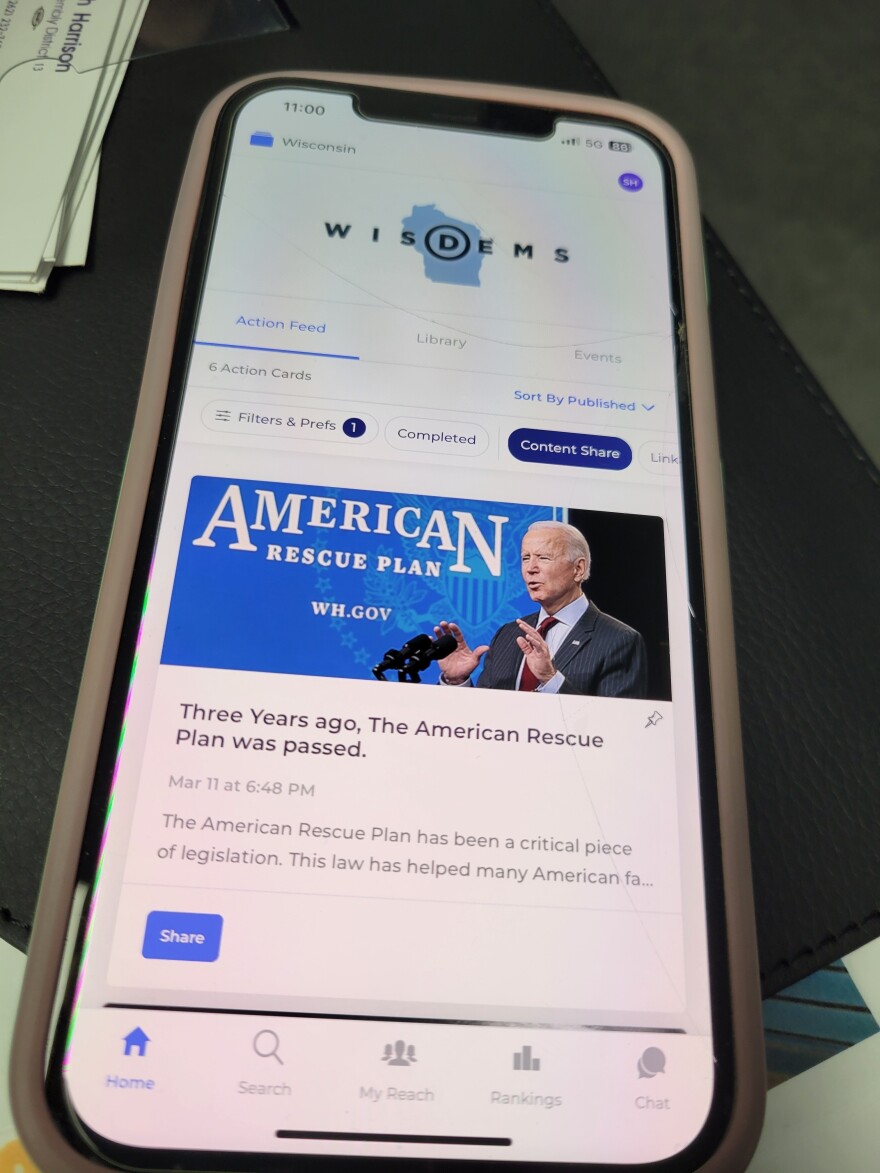 The Reach app, as seen on volunteer Sarah Harrison's phone, allows Biden supporters to share content directly with their contacts, and is connected to a national Democratic party voter database.