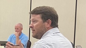 Washington Public Works Director Brian Rittenhouse answers a question about a water tower painting project during Tuesday's City Council meeting.