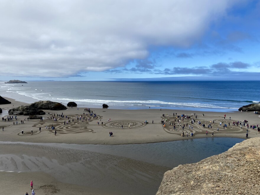 Visitors to Circles in the Sand walk the labyrinth on Aug. 5 in Bandon, Oregon.