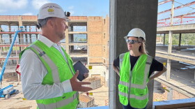Secretary of State Jocelyn Benson tours a housing construction site in Muskegon.