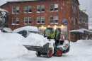An operator scoops snow in downtown Juneau on Tuesday, Dec. 30, 2025.