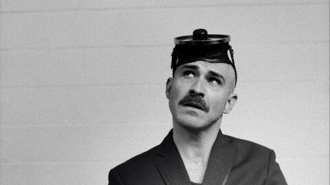 Los Angeles based singer, songwriter Joshua Thomas poses with what looks to be a scuba mask on his head.