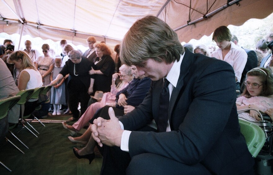 Kevin Von Erich in mourning at Grove Hill Memorial Park in Dallas during the funeral of his brother, Mike Von Erich, April 18,1987.