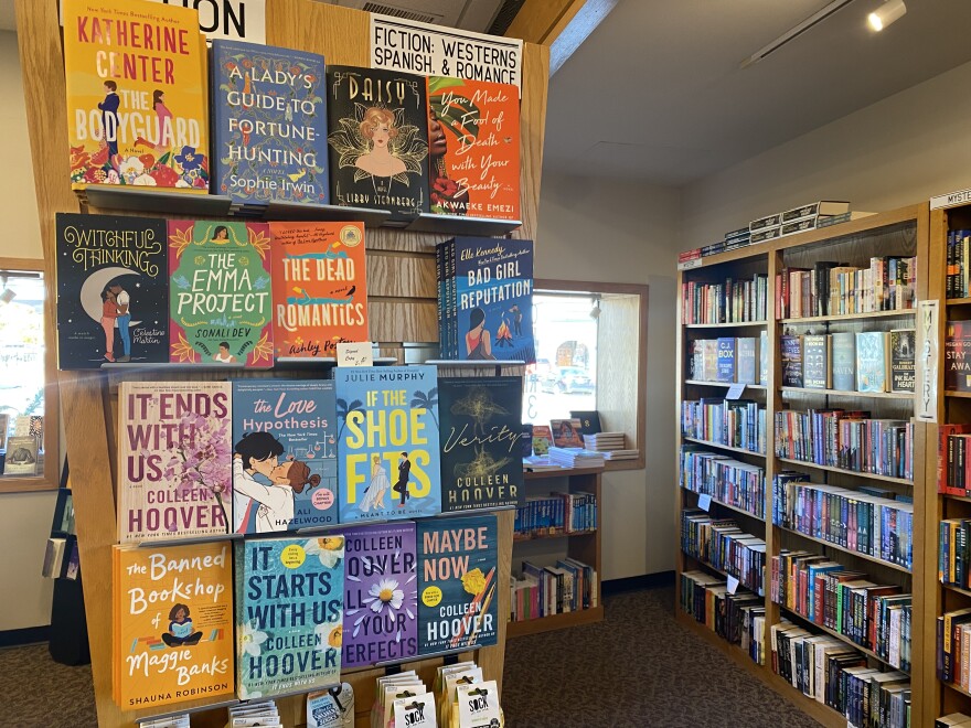 A display at Watermark Books & Cafe in Wichita features books by Colleen Hoover, who is popular on BookTok.