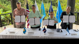 During the Pacific Islands Forum in Palau, from left, acting Peace Director Christopher Landau, President Surangel Whipps Jr. of Palau, President Hilda Heine of the Marshall Islands, and President Wesley Simina of the Federated States of Micronesia sign an agreement stating their mutual interest in the Peace Corps' return to the North Pacific on Sept. 2, 2026.