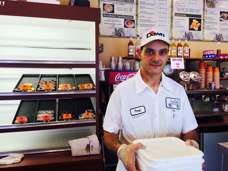 Tony Lordi, production manager at Judy's Bakery in North Kansas City, Mo., holds a 30-pound bucket of liquid egg, which has doubled in cost since May, as a lethal outbreak of avian flu has decimated laying hens in the Midwest.