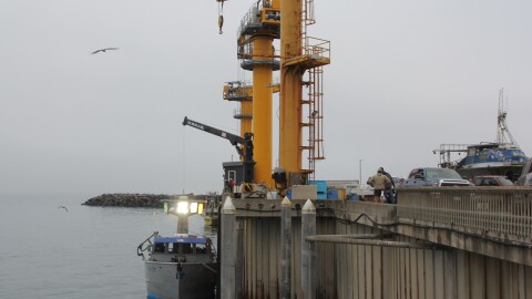 The Port of Port Orford uses cranes to lift and lower fishing boats from the ocean. A hoist, shown here Aug. 5, 2026, lifts seafood and gear from the boats onto the dock.