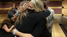 Gena Hoyer, right, hugs Debbie Hixon during a court recess following Marjory Stoneman Douglas High School shooter Nikolas Cruz’s guilty plea on all 17 counts of premeditated murder and 17 counts of attempted murder in the 2018 shootings. Hoyer’s son, Luke Hoyer, 15, and Hixon’s husband, Christopher Hixon, 49, were both killed in the massacre. This at the Broward County Courthouse in Fort Lauderdale on Wednesday, Oct. 20, 2021. (Amy Beth Bennett/South Florida Sun Sentinel via AP, Pool)