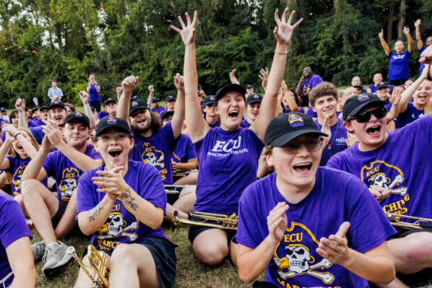 ECU Marching Pirates members cheer after finding out they will perform in the 101st Macy’s Thanksgiving Day Parade in 2027.