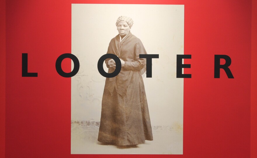 Phtos of Johaness Barfield's murals on display at the Greenville Museum of Art.