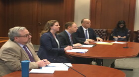 City of Cincinnati Attorneys (center) say they don't want to interfere with the federal case against Councilwoman Tamaya Dennard and will consider that in making their decision.