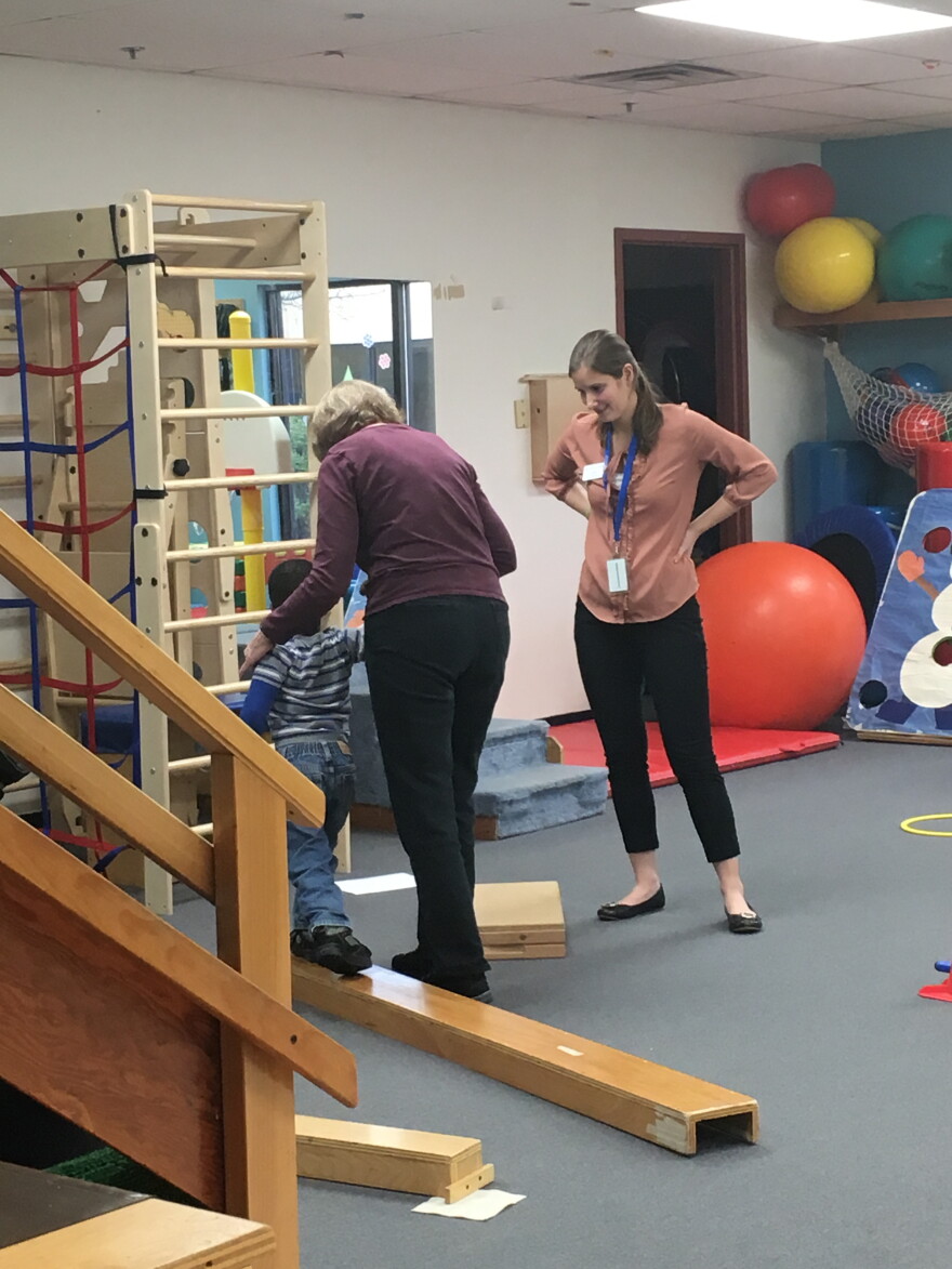 Karen Terp (left) and intern, Sarah, during a child's daily physical therapy session at CP Rochester.