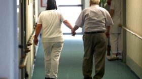 Caregiver aids resident of nursing home