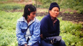 Cheu Chang, right, at the Indochinese Farm Project in Woodinville in the mid-80s.