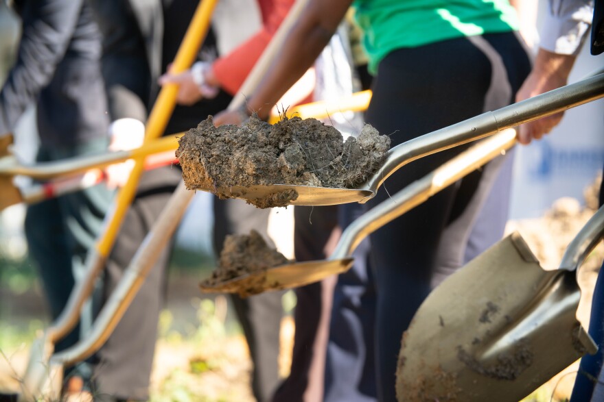 Assembled members of the local Catholic Diocese, Habitat for Humanity and the future homeowner, complete the ceremonial groundbreaking of the future habitat for Humanity home on Florence Street in Evansville, Thursday, Oct. 9.