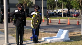A Sheriff's Department honor guard performed the wreath laying in front of the headquarters building.