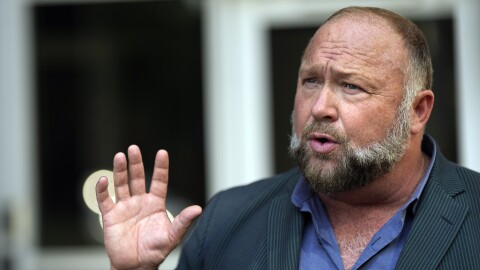 FILE - Right-wing conspiracy theorist Alex Jones speaks outside the federal courthouse after a bankruptcy hearing Friday, June 14, 2024, in Houston. (AP Photo/David J. Phillip, File)