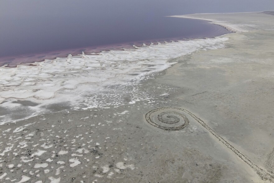 An aerial view shows the Spiral Jetty along the shore of the Great Salt Lake, Thursday, Oct. 8, 2020, in Howell, Utah.