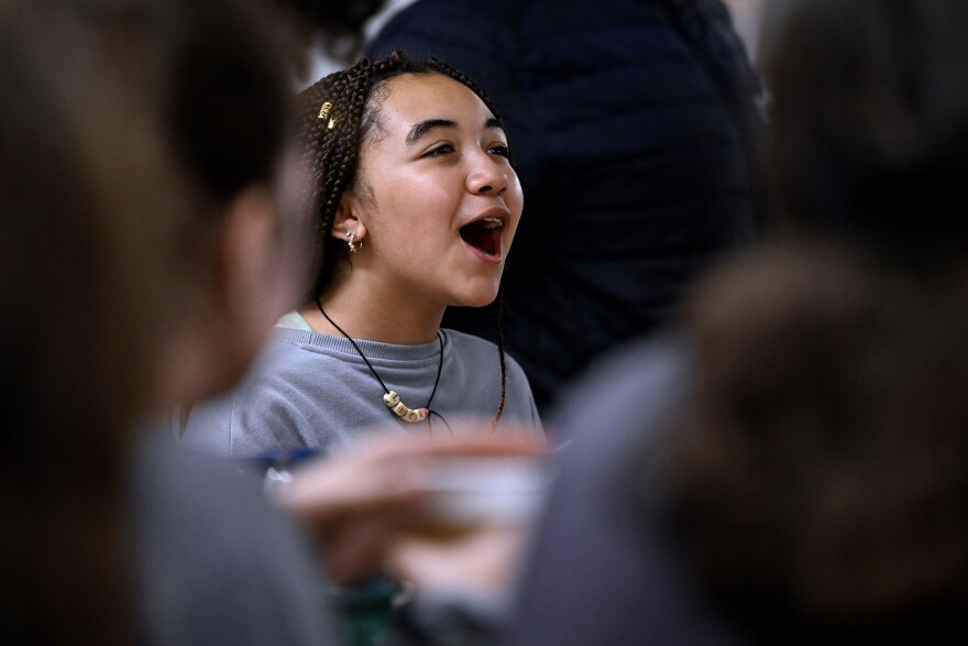 Lucienne Ghassan, 13, of Brooklyn, NY chanting with her team during a chant battle at Experience Camps, a free grief camp for kids whose parent died, that expanded to Connecticut this year at Camp KenWood and KenMont, in Kent, Connecticut August 20th 2025.