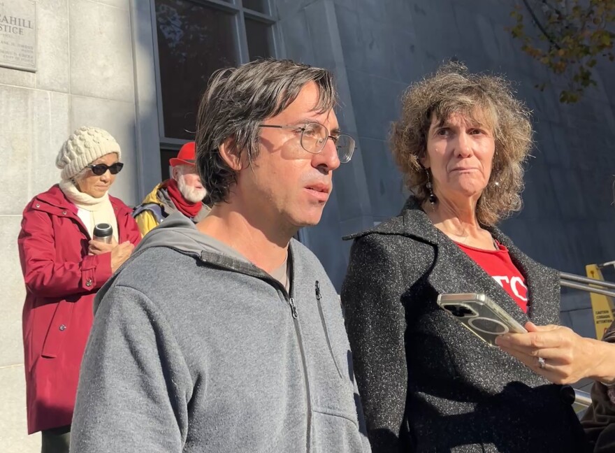 Guido Reichstadter and Wynd Kaufmyn stand outside of the Bryant St. courthouse on 11/21/25