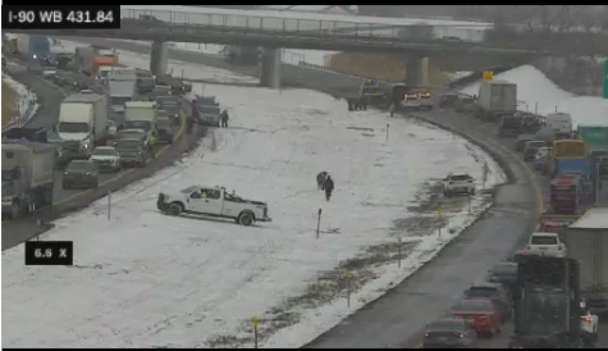 A screenshot shows cows in the median of I-90 between delayed traffic on both eastbound and southbound lanes.
