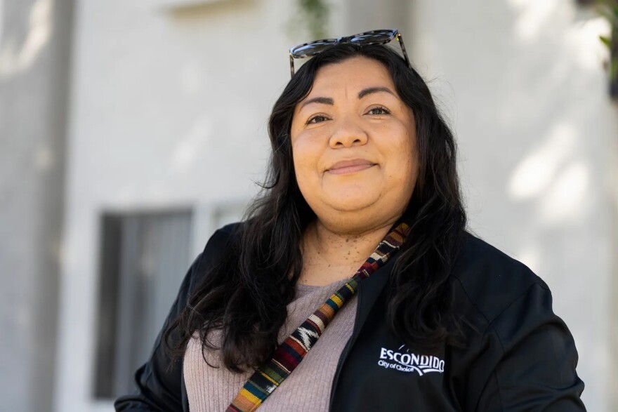 Councilmember Consuelo Martínez walks around a neighborhood in Escondido and talks about how multiple apartment complexes have tenants raising the alarm about increased rents, threatened evictions, and a lack of basic services.