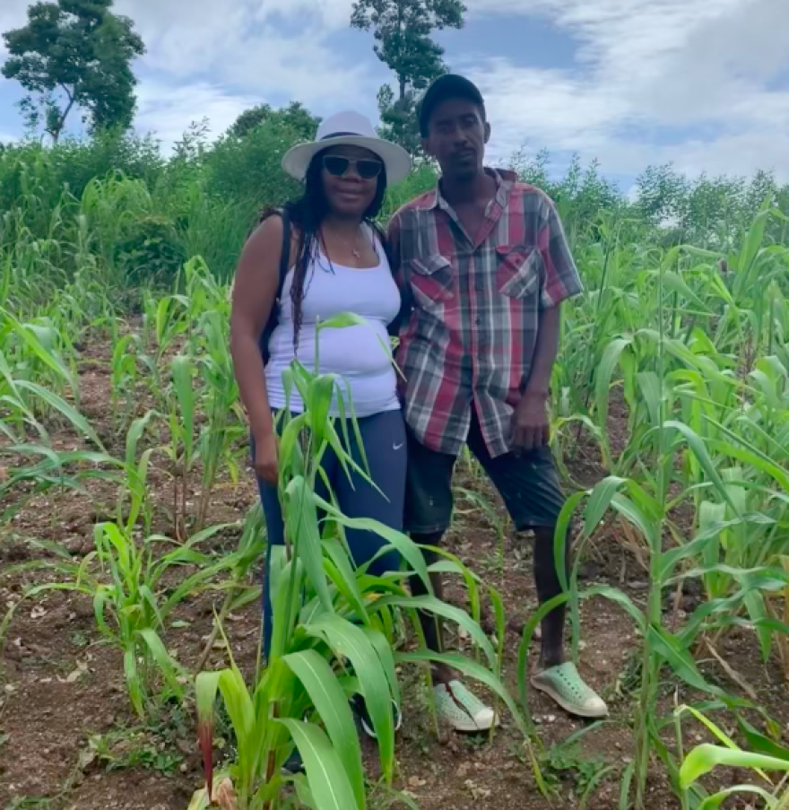 Marie Lambert (left) on her farm near Jacmel in southeast Haiti with a young Haitian trainee, Iva Recule.