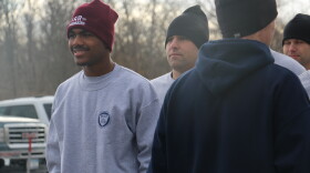 Chase Coleman (left) prepares to run with Rochester Police recruits.