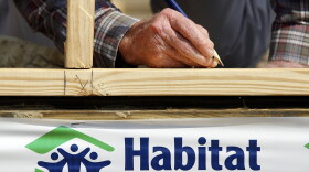 FILE: Former U.S. President Jimmy Carter signs a beam on the 1,000th home to be built by Habitat for Humanity on the Gulf Coast May 21, 2007 in Violet, Louisiana.