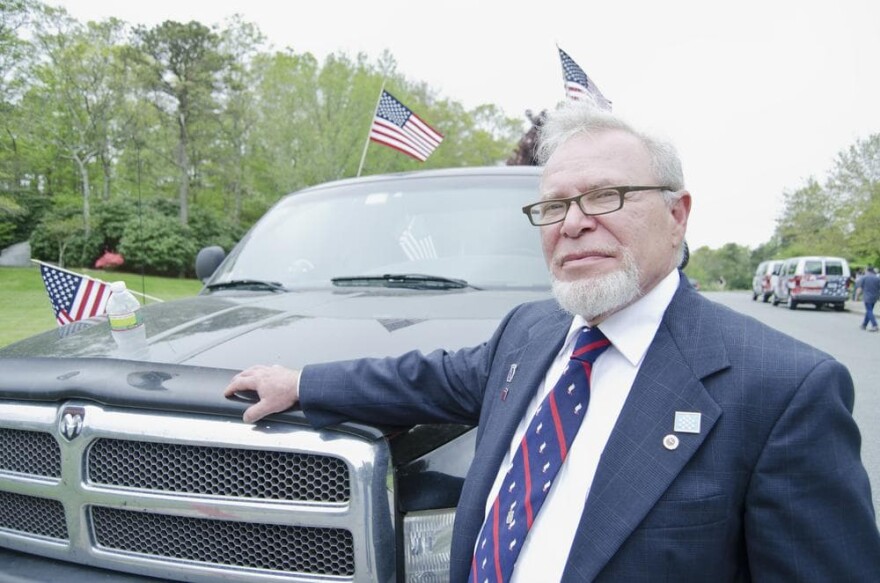Paul Monti next to the truck of his son, Jared Monti. Jared Monti died while serving in Afghanistan in 2006. (Anna Miller/Here & Now)