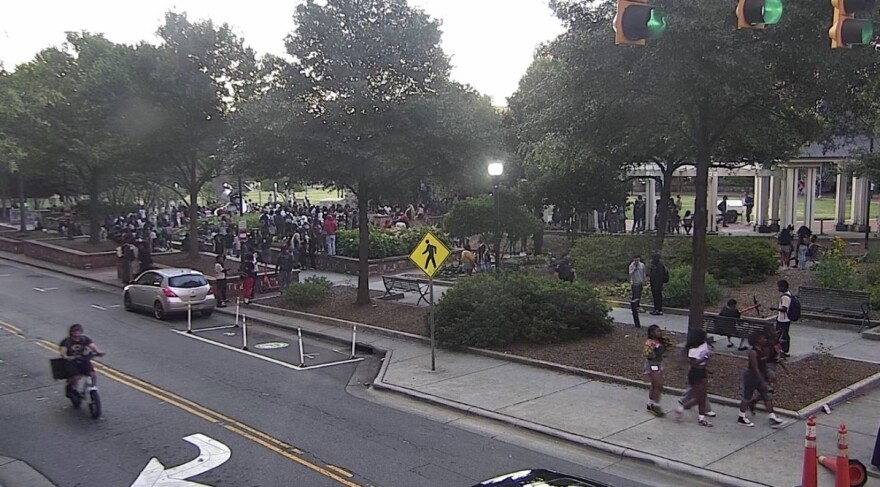 Large group of teenagers gathers in Romare Bearden Park.