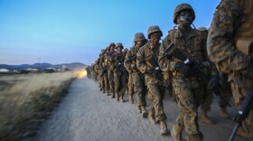Recruits of Golf Company, 2nd Recruit Training Battalion, push through adversity to carry an ammunition can during the resupply hike at Edson Range, Marine Corps Base Camp Pendleton, Calif., April 28.