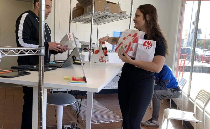 A driver picks up a Chick-fil-A order at the DoorDash kitchen in Redwood City, Calif. DoorDash's tenants include national chains as well as Bay Area brands.
