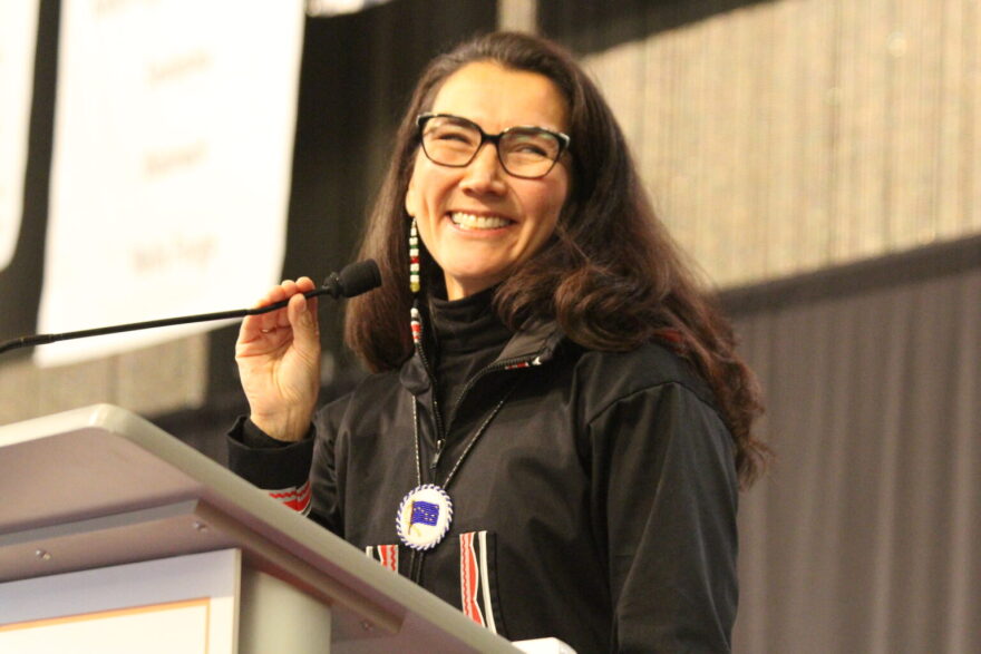 Congresswoman Mary Peltola addresses the AFN convention on Thursday wearing the bolo tie gifted to her by the daughters of late Congressman Don Young.