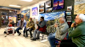 Delbert Anderson leads musicians in performing a single note, as part of a 4.5 year long performance of a composition called "The Long Walk."