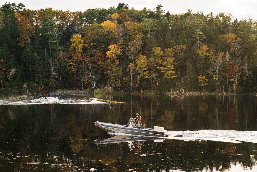 Law enforcement officers travel on the Androscoggin River as the search continues in the aftermath of a mass shooting, in Lisbon Falls, Maine, Friday, Oct. 27, 2023. A U.S. Army reservist who killed 18 people at a bowling alley and a bar in Lewiston, was found dead Friday, Oct. 27, two days after the shooting.