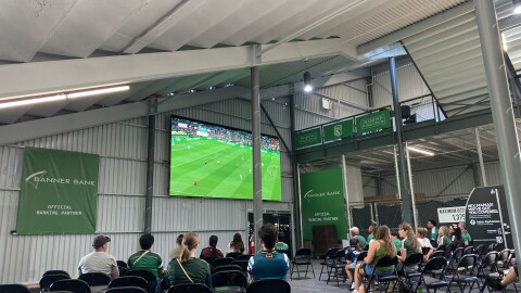 Crowd of people sit inside Athletic Club Boise watching Mexico V Czechia game